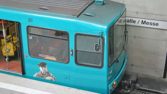 Head of a turquoise subway in the station Festhalle/Messe