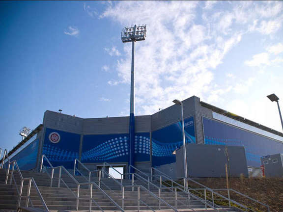 Staircase to a blue soccer stadium