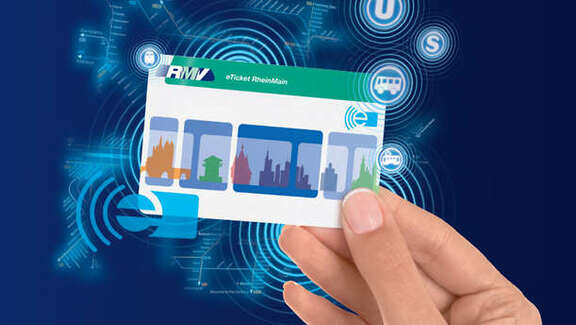 a hand holding the eTicket card, blue background