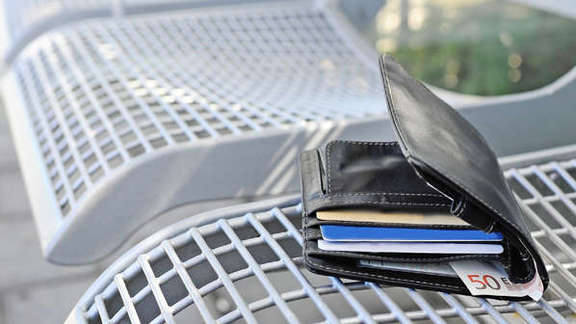 Wallet on a bench on the platform
