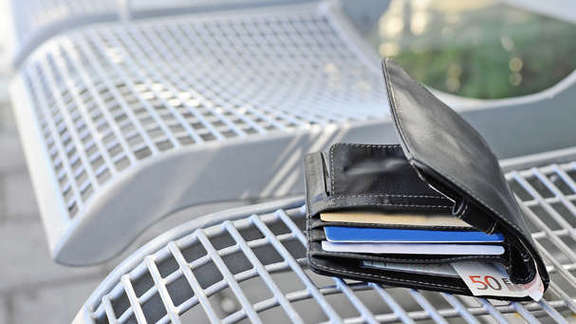 Wallet on a bench on the platform
