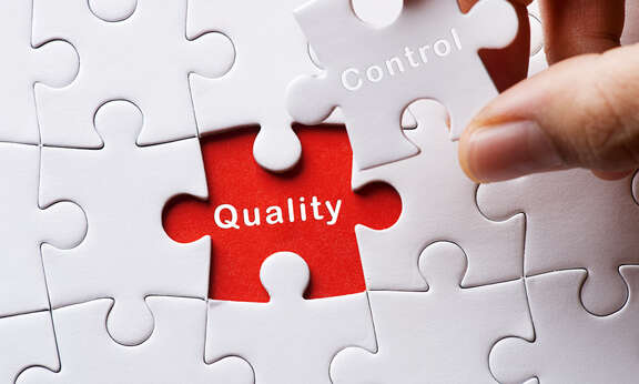 Puzzle, auf dem letzten Teil steht control und unter diesem Teil steht Quality