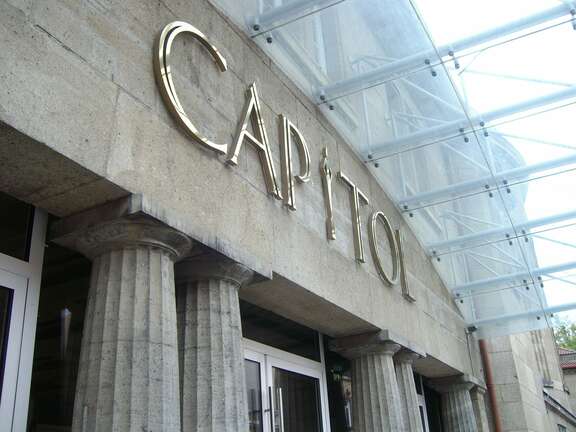 External facade of a stone building with lettering "Capitol"